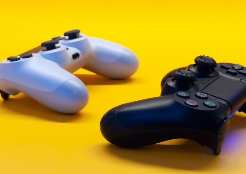 Two video game console controllers side by side.